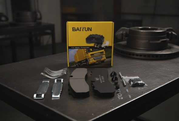 truck brake pads bulk order China – BAIYUN heavy-duty commercial vehicle brake pad on textured background